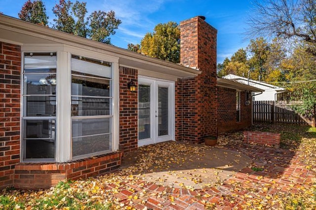 back of property featuring french doors and a patio