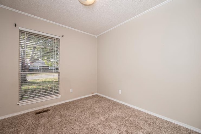 carpeted empty room with ornamental molding, a textured ceiling, and vaulted ceiling