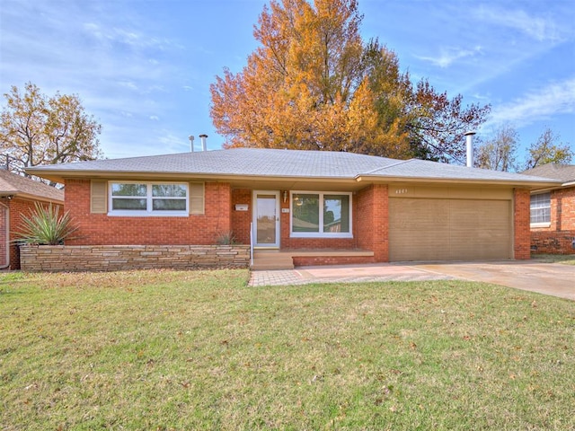 ranch-style house with a front yard and a garage