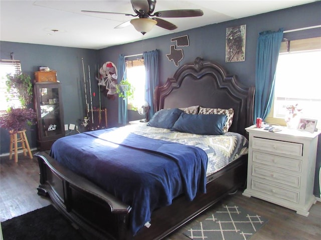 bedroom featuring dark hardwood / wood-style flooring and ceiling fan