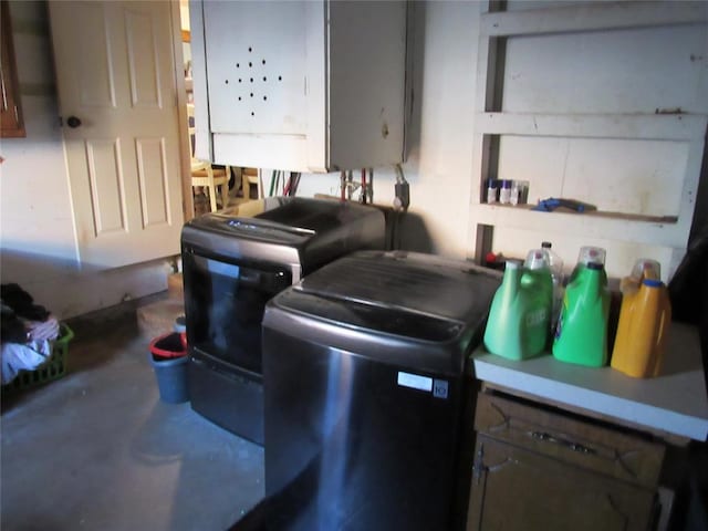 kitchen with washer / dryer and concrete floors