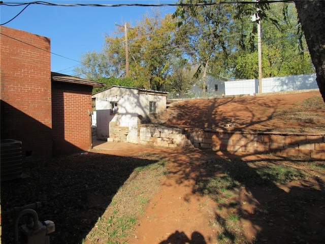 view of yard featuring central AC