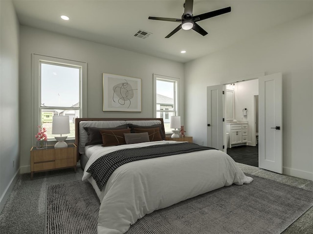 bedroom with ensuite bath and ceiling fan