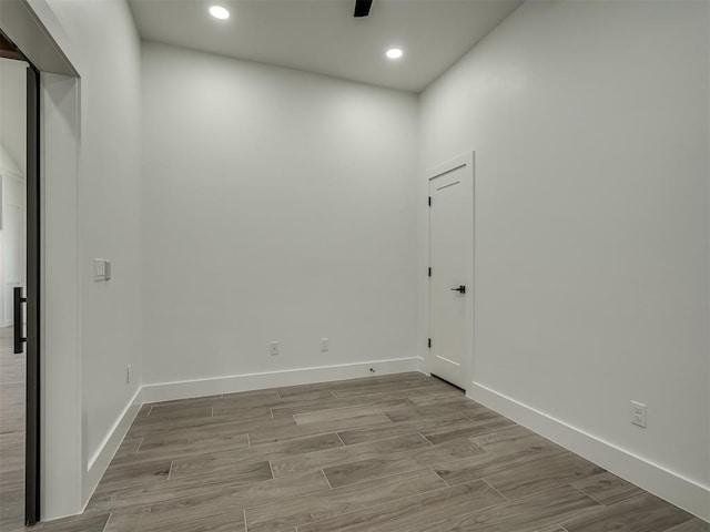 unfurnished room featuring ceiling fan and light hardwood / wood-style flooring