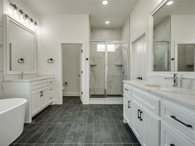 full bathroom with vanity, toilet, and independent shower and bath