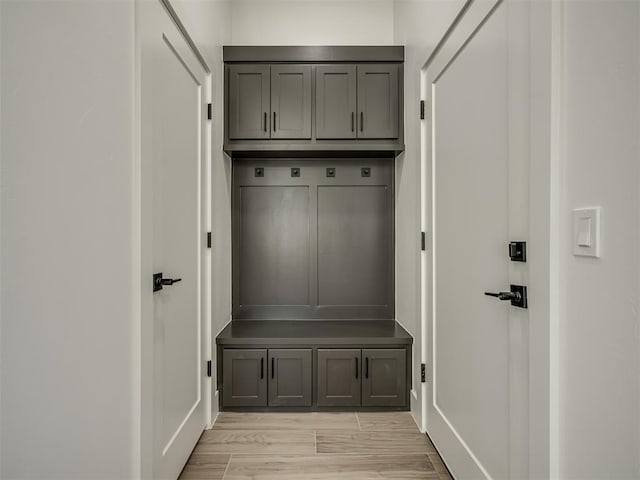 mudroom with light hardwood / wood-style floors