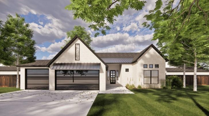 view of front of home featuring a front lawn and a garage