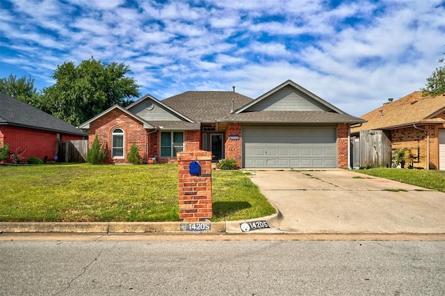 single story home with a front yard and a garage