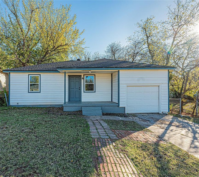 ranch-style home with a front yard and a garage