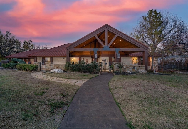 craftsman-style home with a yard