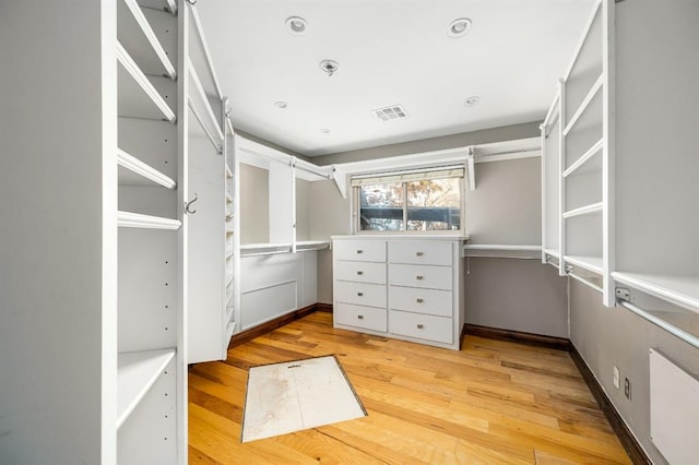 spacious closet featuring light wood-type flooring