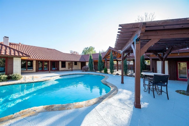 view of pool with a patio and a pergola