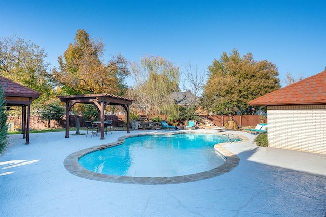 view of pool with a patio, a pergola, and a gazebo