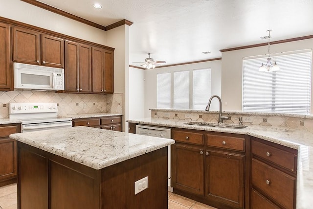 kitchen with dishwasher, sink, range with electric stovetop, decorative light fixtures, and ceiling fan with notable chandelier