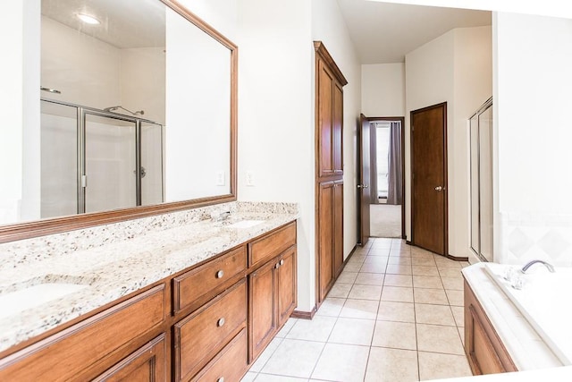 bathroom featuring tile patterned floors, vanity, and separate shower and tub