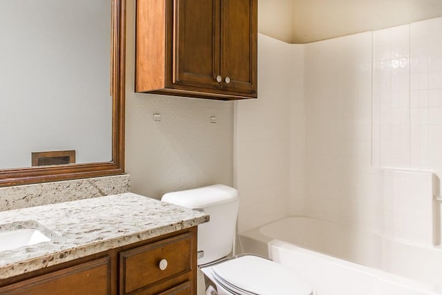 full bathroom featuring shower / bathing tub combination, vanity, and toilet