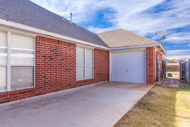 view of side of property with a garage