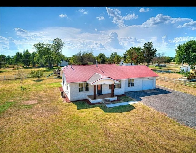 ranch-style home with a front yard and central AC