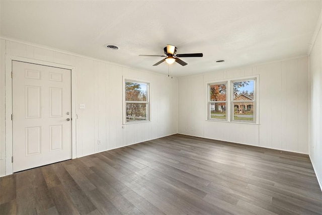 907 S Wilson Ave, El Reno, OK 73036 - empty room featuring dark hardwood / wood-style floors, plenty of natural light, crown molding, and ceiling fan