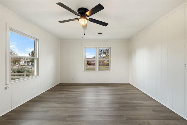 907 S Wilson Ave, El Reno, OK 73036 - unfurnished room featuring ceiling fan, dark hardwood / wood-style flooring, and crown molding