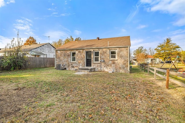 907 S Wilson Ave, El Reno, OK 73036 - rear view of property featuring a lawn and cooling unit
