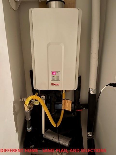 utility room with water heater