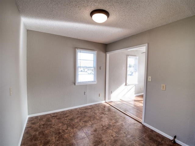 spare room featuring a textured ceiling