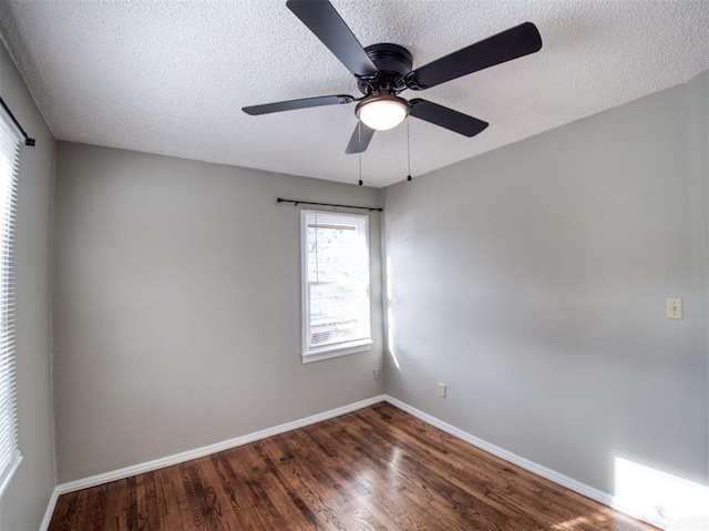 empty room with ceiling fan, a textured ceiling, and hardwood / wood-style flooring