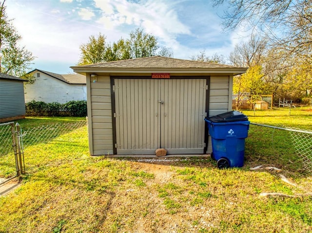 view of outbuilding featuring a yard