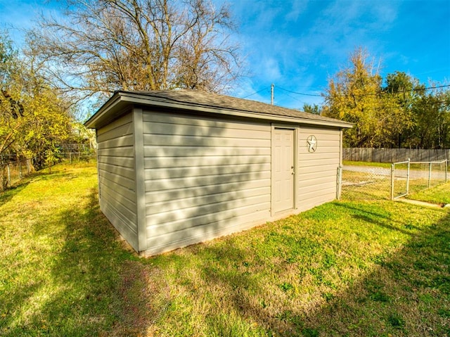 view of outbuilding featuring a yard