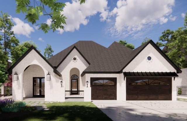 view of front of property featuring french doors and a garage