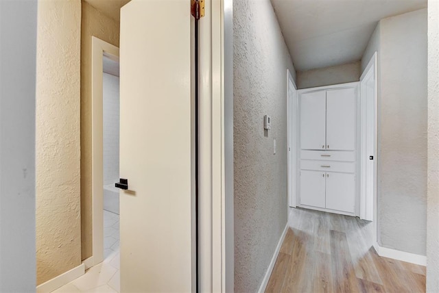 corridor featuring light hardwood / wood-style flooring