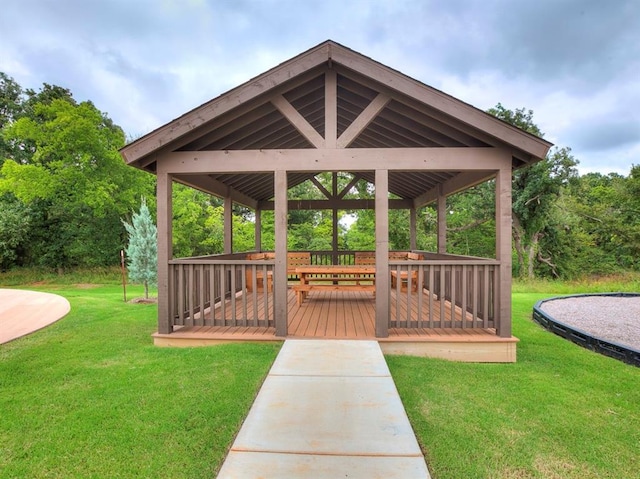 surrounding community featuring a gazebo, a lawn, and a deck