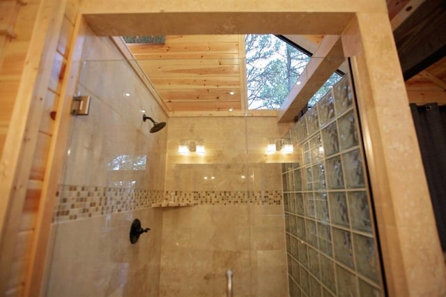 bathroom with tiled shower