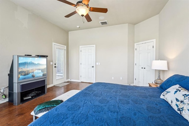 bedroom featuring ceiling fan and dark hardwood / wood-style floors