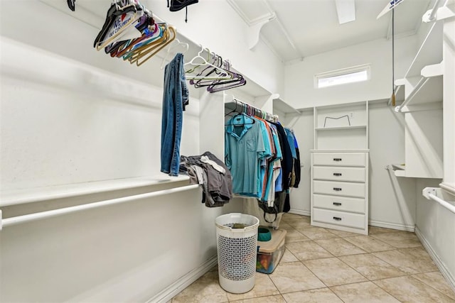 spacious closet featuring light tile patterned flooring