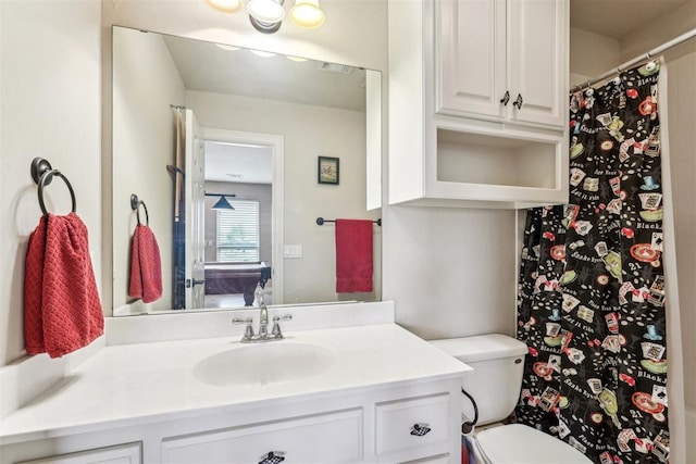 bathroom with vanity and toilet