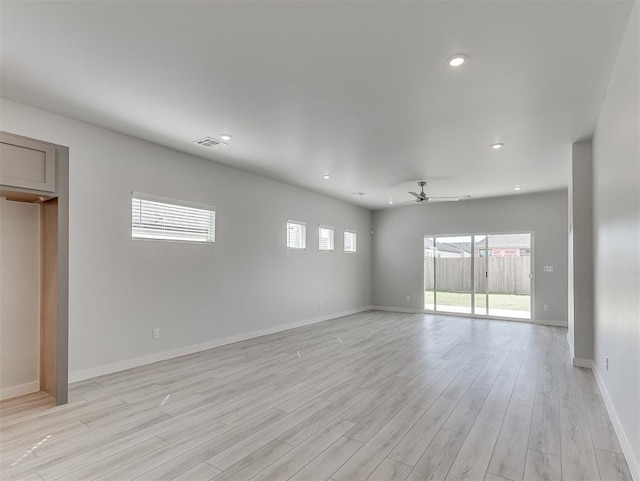 unfurnished room featuring ceiling fan and light wood-type flooring