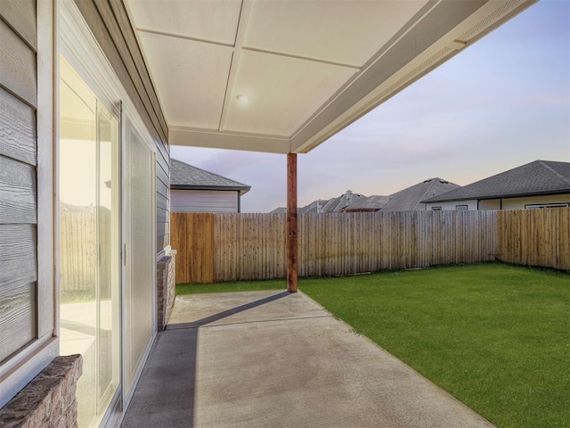 patio terrace at dusk with a lawn