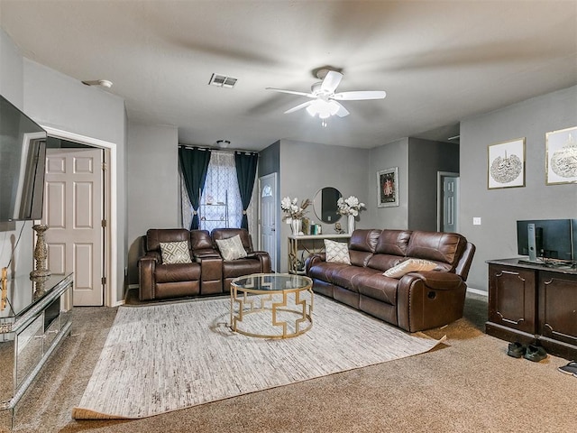 living room featuring carpet floors and ceiling fan