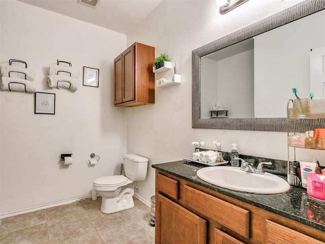 bathroom featuring toilet and vanity