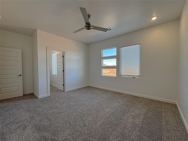 unfurnished bedroom featuring ceiling fan and carpet flooring