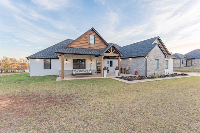 2063 County Road 1336, Blanchard, OK 73010 - modern inspired farmhouse with roof with shingles, a front lawn, stone siding, and a porch