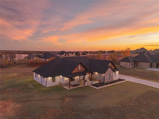 2063 County Road 1336, Blanchard, OK 73010 - view of front of property with a yard, stone siding, and driveway