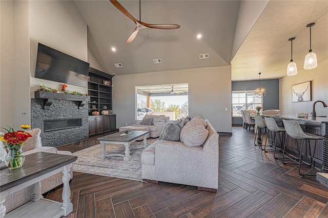2063 County Road 1336, Blanchard, OK 73010 - living area with ceiling fan, high vaulted ceiling, a stone fireplace, and recessed lighting