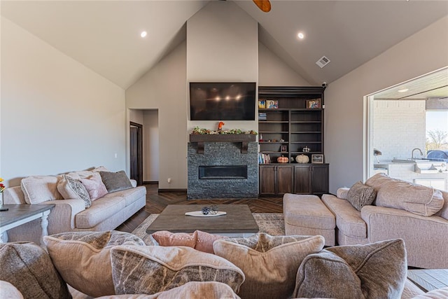 2063 County Road 1336, Blanchard, OK 73010 - living room featuring high vaulted ceiling, a glass covered fireplace, and recessed lighting