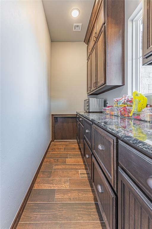 2063 County Road 1336, Blanchard, OK 73010 - bar area with dark wood-type flooring and baseboards
