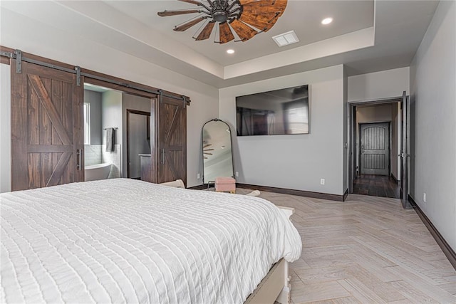 2063 County Road 1336, Blanchard, OK 73010 - bedroom featuring a barn door, a raised ceiling, recessed lighting, and ceiling fan