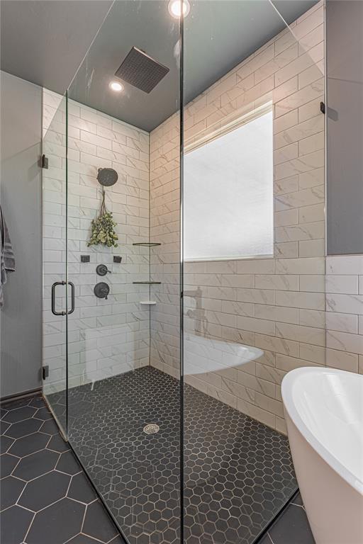 2063 County Road 1336, Blanchard, OK 73010 - bathroom with a shower stall, tile patterned flooring, a soaking tub, and recessed lighting