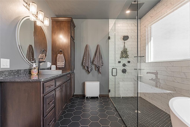 2063 County Road 1336, Blanchard, OK 73010 - bathroom with a freestanding tub, vanity, a shower stall, and tile patterned flooring